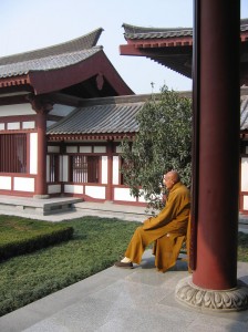 Image of a monk in a courtyard